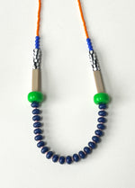 Load image into Gallery viewer, Modern Necklace with orange, green beads, and blue beaded strands on a white background. By Forme jewellery in Leeds

