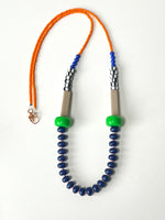 Load image into Gallery viewer, Modern Necklace with orange, green beads, and blue beaded strands on a white background. By Forme jewellery in Leeds
