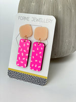 Load image into Gallery viewer, NEON PINK DANGLY RECTANGULAR EARRINGS WITH A WHITE DASH PATTERN
